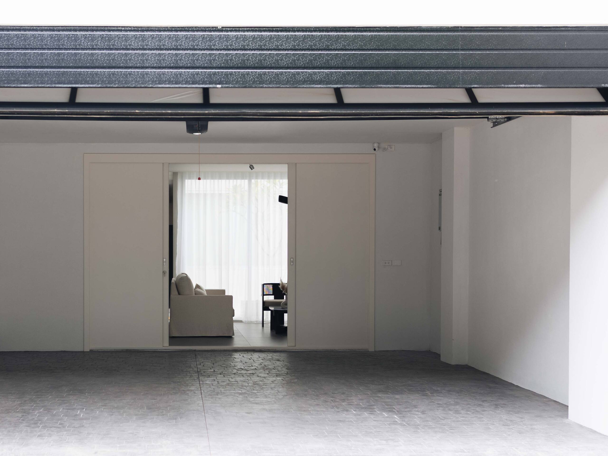 White sliding doors between Aube's garage and living room