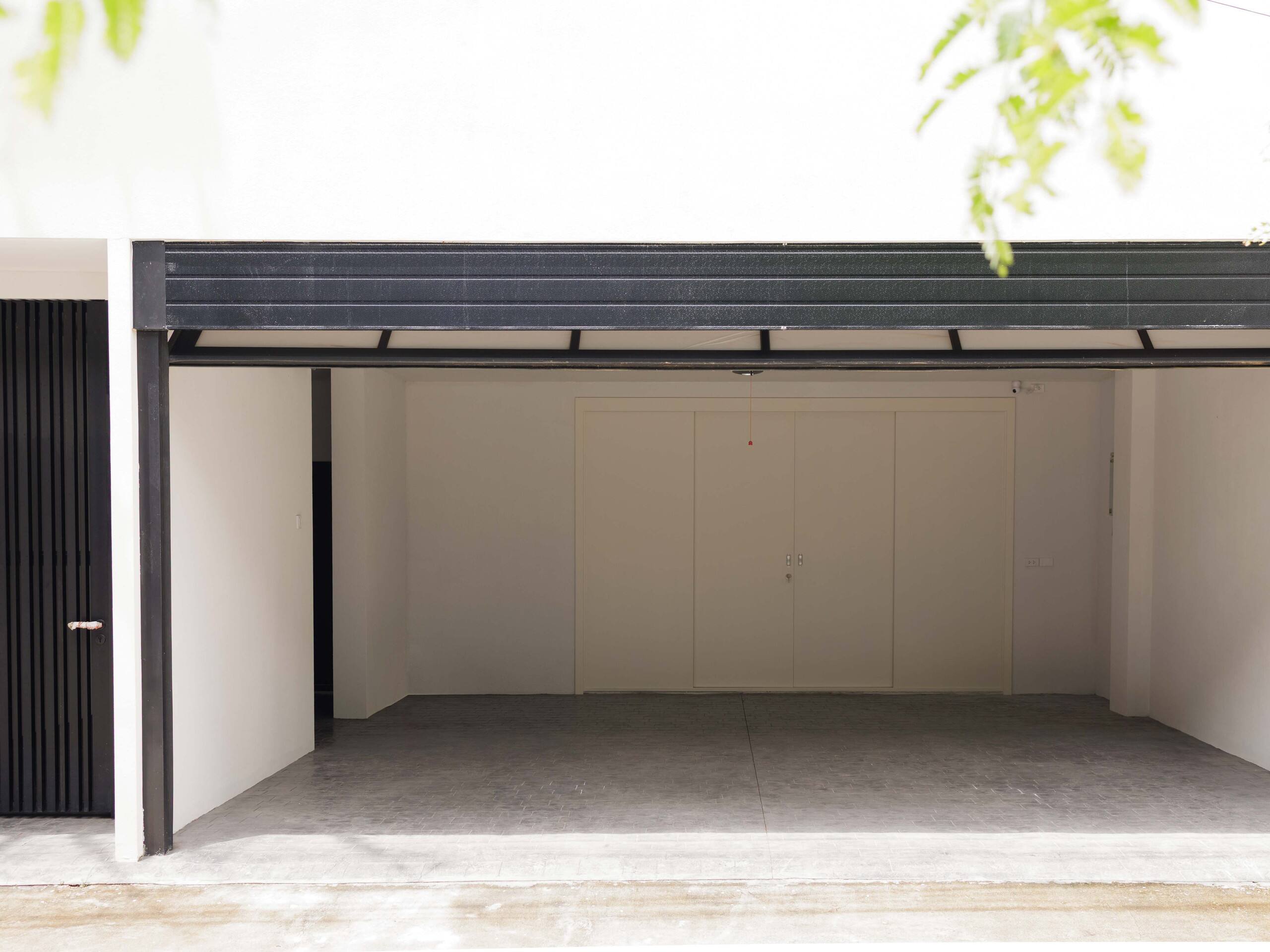 Original photograph of the empty garage at Aube Chiang Mai